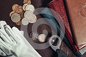 Photo of numismatist table with coins