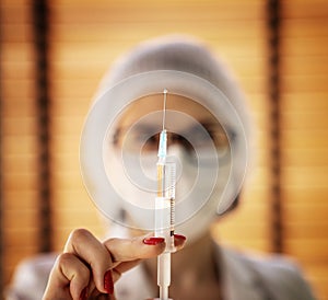 Photo of a nurse preparing a vaccine injection