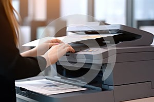 Photo of office& x27;s people using multifunction printer