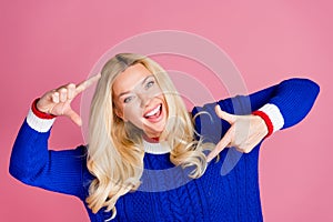 Photo oflady have fun show cadre symbol wear blue sweater isolated on pink color background