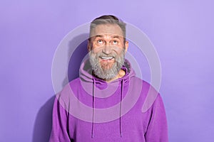 Photo of old aged pensioner man grandfather look interested up information good news smile isolated on pastel purple