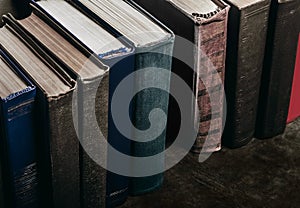 Photo of old antique books row on table