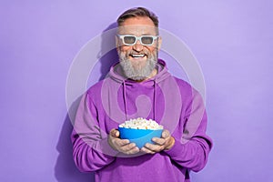 Photo of old retired good mood handsome man wear purple hoodie 3d glasses ready to watch comedy film isolated on violet