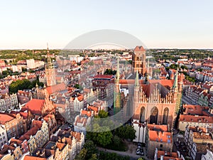 Photo of the old town of Gdansk architecture in sunset light. Aerial shot. Channel and buildings - top view