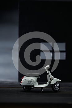 Photo of an old Vespa which is also called a scooter