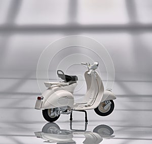 Photo of an old Vespa which is also called a scooter