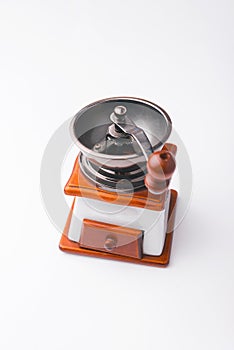 Photo of old vintage coffee grinder over white background