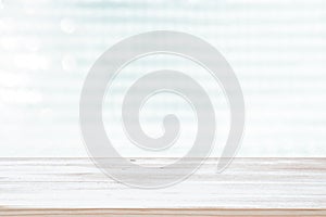 Photo of old wooden table in front of white and silver glitter lights background. Ready for product display montage