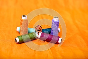 Photo of one bobbin and sewing thread