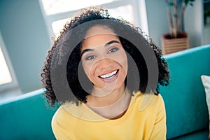 Photo of optimistic lovely girlish cute pretty woman with perming coiffure wear yellow long sleeve smiling laughing at