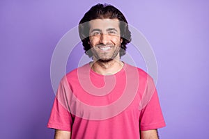 Photo of optimistic nice brunet guy wear pink t-shirt isolated on pastel violet color background