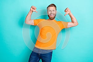 Photo of optimistic self confident man blond hairstyle dressed orange t-shirt directing at himself isolated on teal