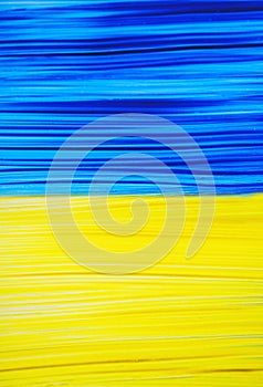 Photo of painting Ukraine flag on window. Ukraine flag brush concept. Color image of flag of Ukraine on glass with paints. Banner