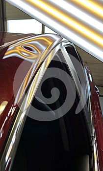 A photo of a paintless dent repair light showing a large dent