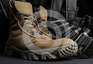 Photo of a pair of military boots with armor vest