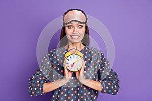 Photo of panic nervous girl hold clock feel fear missed time meeting wear dotted sleep wear eye mask isolated over