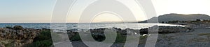 Photo panorama. Beach on the Mediterranean coast in Pefkos or Pefki, Rhodes island, Greece