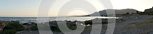 Photo panorama. Beach on the Mediterranean coast in Pefkos or Pefki, Rhodes island, Greece