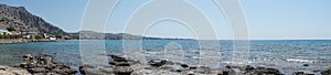 Photo panorama. Beach on the Mediterranean coast in Pefkos or Pefki, Rhodes island, Greece