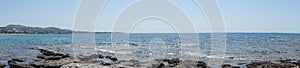 Photo panorama. Beach on the Mediterranean coast in Pefkos or Pefki, Rhodes island, Greece