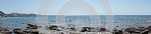 Photo panorama. Beach on the Mediterranean coast in Pefkos or Pefki, Rhodes island, Greece