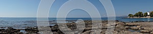 Photo panorama. Beach on the Mediterranean coast in Pefkos or Pefki, Rhodes island, Greece