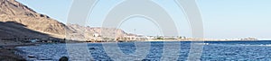 Photo panorama. Beautiful seascape of the Red Sea in the Gulf of Aqaba. Dahab, South Sinai Governorate, Egypt