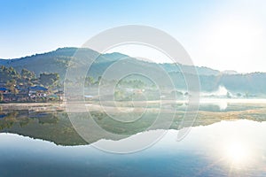 Photo panorama of morning with white fog over lake at Ban Rak Thai village, Maehongson or Mae Hong Son Thailand.