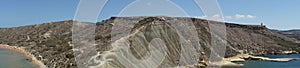 Photo panorama. Mountain isthmus between Qarraba Bay and Ghajn Tuffieha Bay.