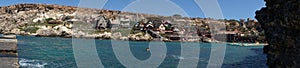 Photo panorama. Popeye Village, also known as Sweethaven Village, is located in Anchor Bay. Triq Tal-Prajjet, Il-Mellieha, Malta.