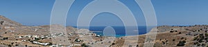 Photo panorama. View of Navarone Bay and surrounding area in August. Lindos, Rhodes island, Greece