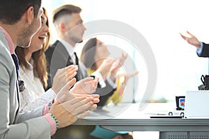 Photo of partners clapping hands after business seminar. Professional education, work meeting, presentation or coaching