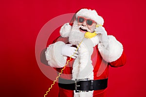 Photo of pensioner old man grey beard hold wired telephone talk snow maiden receive compliment hand chest wear x-mas