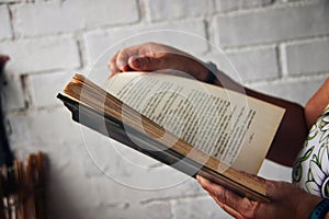 Person reading a book outdoors. photo