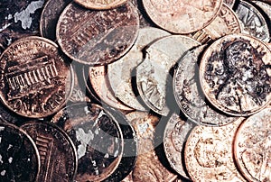 Photo of a pile of american Lincoln cent damaged coins