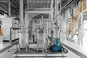 Photo of pipes and tanks. Chemistry and medicine production. Pharmaceutical factory