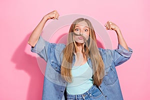 Photo portrait of attractive young teen woman fists flex muscles mustache dressed stylish denim clothes isolated on pink