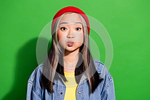Photo portrait of attractive young woman inflate cheeks pouted lips dressed stylish denim clothes isolated on green