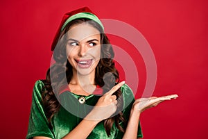 Photo portrait female elf pointing finger copyspace licking lips isolated vivid red color background copyspace