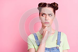 Photo portrait girl in overall thoughtful contemplated looking copyspace isolated pastel pink color background