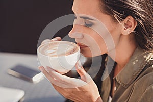 Photo portrait of gorgeous woman enjoying nice cup of coffee inhaling fresh tasty aroma