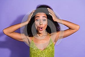 Photo portrait of gorgeous young girl amazed touch head wear trendy green sequins outfit isolated on purple color