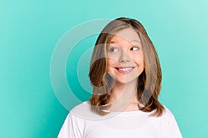 Photo portrait little girl smiling cheerful looking blank space isolated bright teal color background