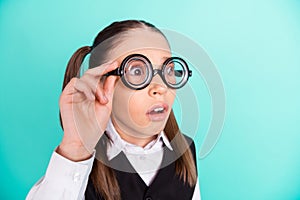 Photo portrait little girl wearing glasses amazed shocked staring isolated pastel turquoise color background