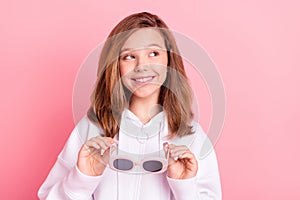 Photo portrait little girl in white hoodie smiling dreaming looking copyspace isolated pastel pink color background