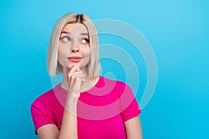 Photo portrait of lovely young lady minded look empty space dressed stylish pink clothes isolated on blue color