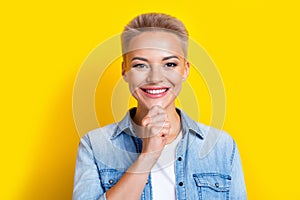 Photo portrait of lovely young lady touch chin minded thinking wear trendy jeans garment isolated on yellow color