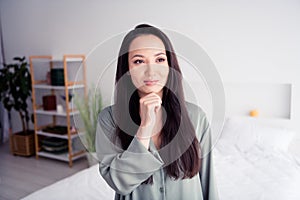 Photo portrait of lovely young lady touch chin thoughtful wear trendy gray sleepwear isolated on white bedroom indoor
