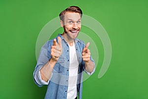 Photo portrait of man pointing finger at you selecting isolated on bright green color background