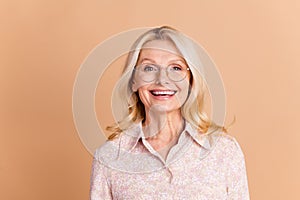 Photo portrait of nice retired female look camera smile wear trendy formalwear  on beige color background